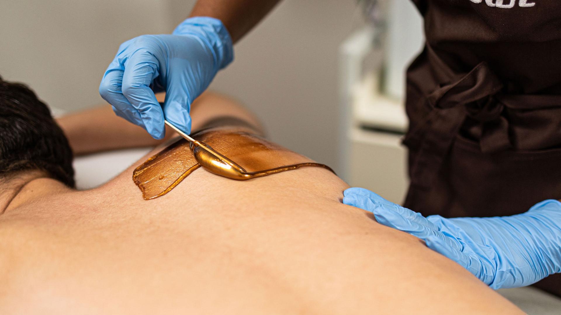 Upper Back Waxing Lagos, Hard Wax Treatment, Professional Body Waxing, Back Hair Removal, Men's Back Waxing, Women's Back Waxing, Luxury Waxing Salon, Beauty Spa Lagos, Hard Wax Hair Removal, Premium Waxing Services.